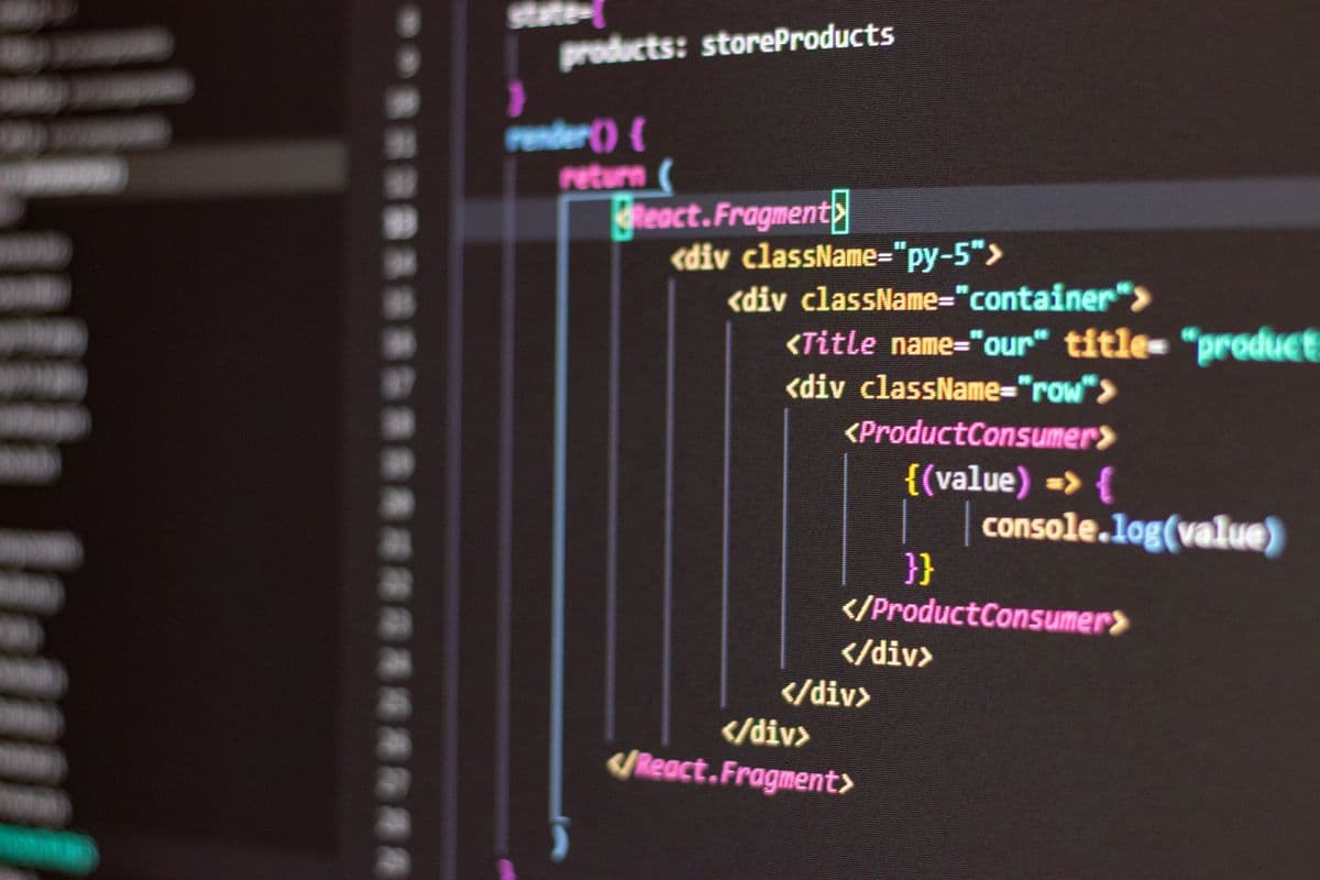 Close-up of a code editor showing deeply nested div tags on screen