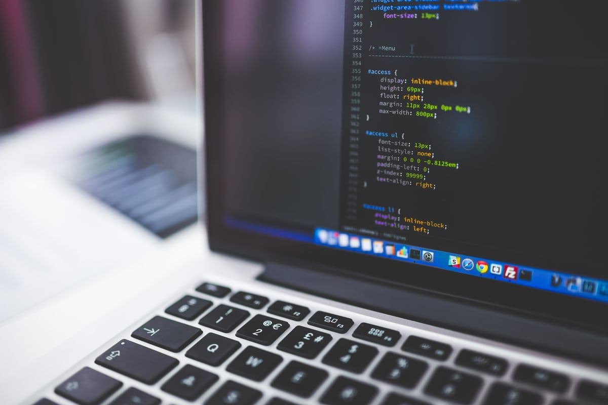 Close-up of a laptop screen showing CSS code in a text editor